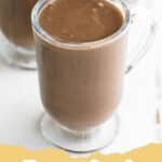 Cozy Up with Tradition: The Best Authentic Mexican Champurrado Recipe 6 A steaming mug of authentic Mexican Champurrado garnished with cinnamon sticks, set against a cozy background.