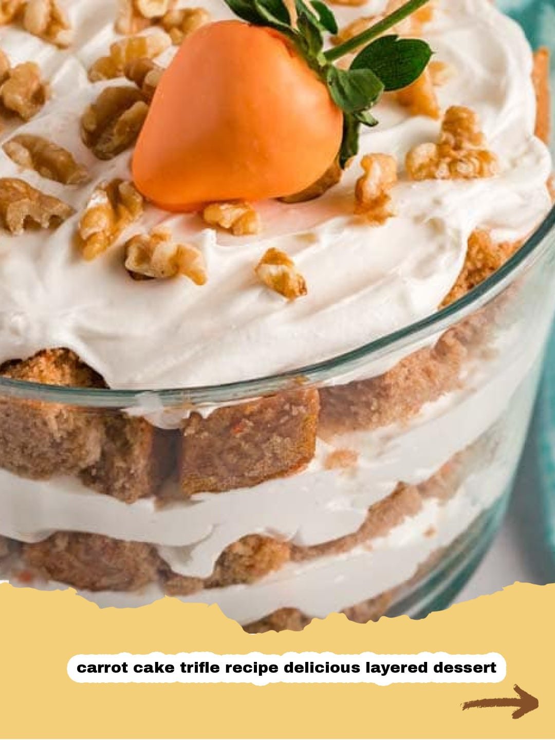 The Ultimate Carrot Cake Trifle: Layers of Creamy Dreaminess! 1 Beautifully layered Carrot Cake Trifle in a clear glass bowl, garnished with pecans and carrot curls.