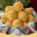 The Whimsical & Delicious Story of No-Bake Moose Farts 6 A plate of whimsical no-bake Moose Farts, rolled in shredded coconut, with some chocolate chips visible.