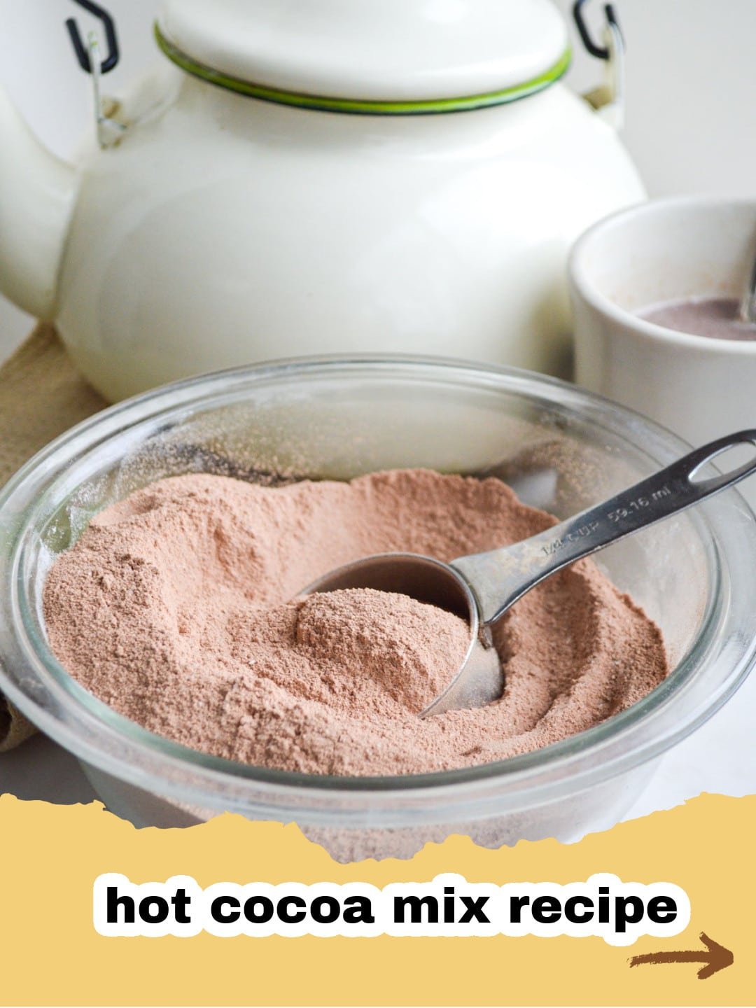 The Ultimate Easy Homemade Hot Cocoa Mix Recipe: Just Add Water for Instant Comfort! 1 Close-up of a mug of homemade hot cocoa with marshmallows and a jar of Easy Homemade Hot Cocoa Mix in the background.