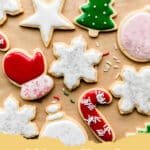 Beautifully decorated Christmas sugar cookies with easy white and colored icing and festive sprinkles.
