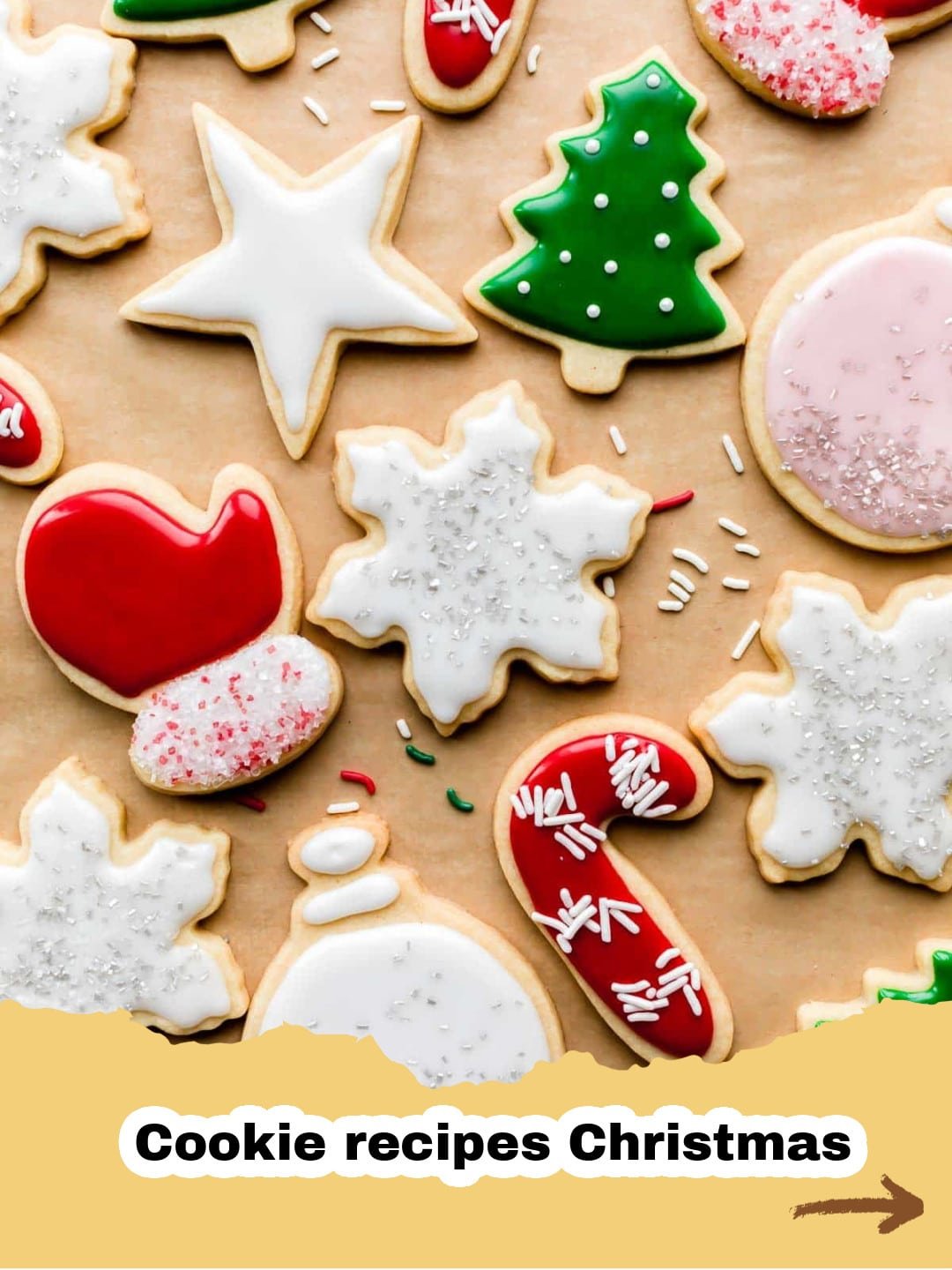 The Best Classic Christmas Sugar Cookies Recipe with Easy Icing 1 Beautifully decorated Christmas sugar cookies with white and red icing, sprinkles, and festive shapes like stars and trees.