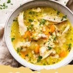 The Ultimate Comfort: How to Transform Your Holiday Leftovers into the Best Turkey Soup 5 A steaming bowl of hearty leftover turkey soup garnished with fresh parsley, served with crusty bread on the side.