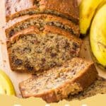 The Ultimate Moist Banana Bread Recipe: A Family Favorite 6 A perfectly baked loaf of moist banana bread on a wooden cutting board, with a few slices cut off revealing its tender crumb and rich banana flavor.