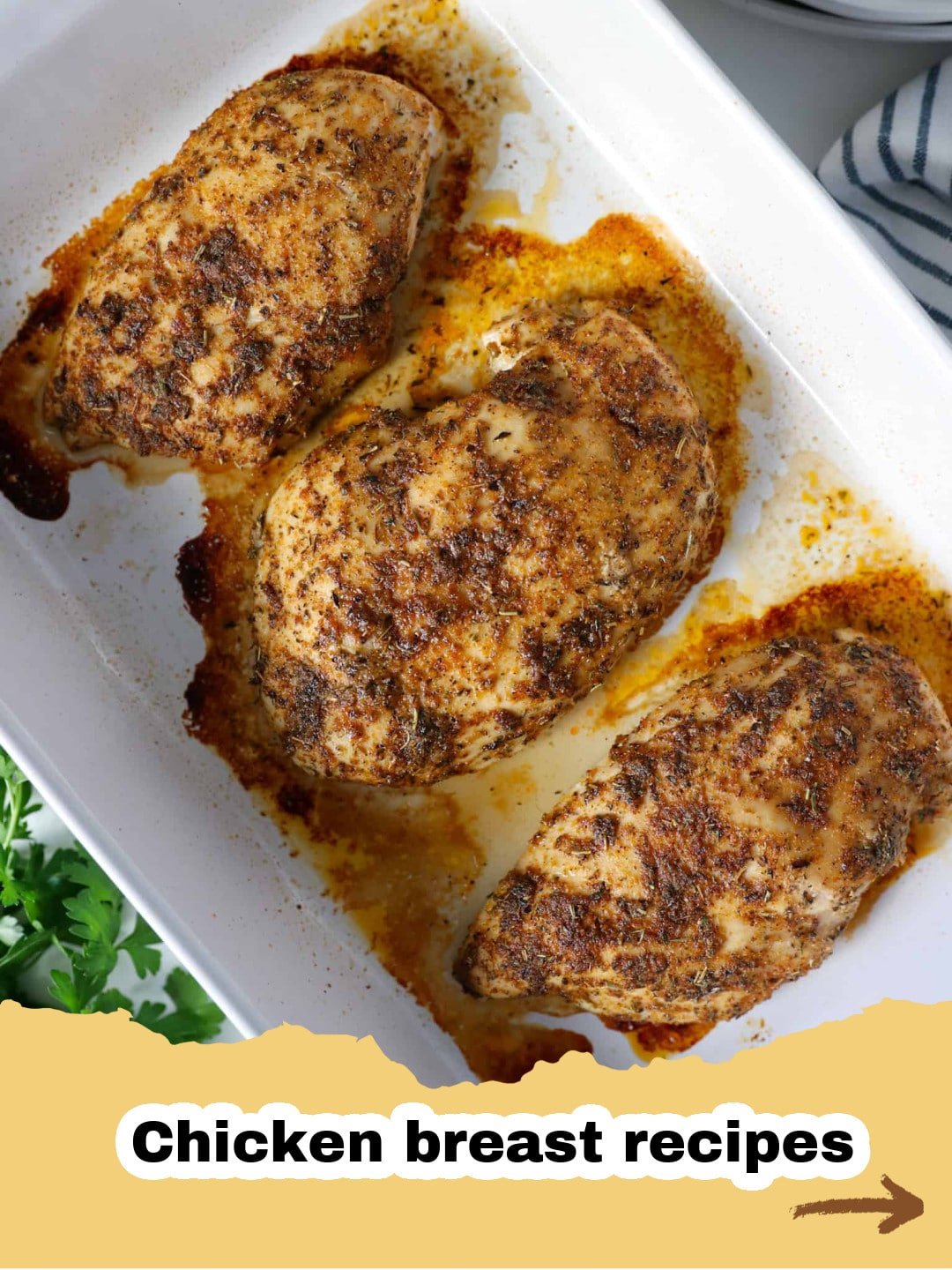 The Ultimate Guide to Perfectly Tender Baked Chicken Breast 1 Perfectly golden-brown baked chicken breast on a white plate with fresh herbs