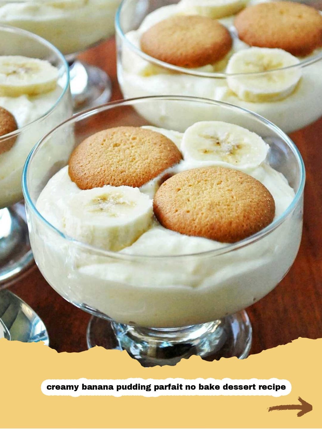 Dreamy No-Bake Banana Pudding Parfaits: Your Easiest Summer Dessert! 1 Close-up of a layered No-Bake Banana Pudding Parfait in a glass, topped with whipped cream and a wafer.