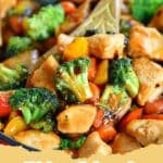 A vibrant Chicken Stir Fry Recipe with colorful vegetables, served in a bowl with chopsticks.