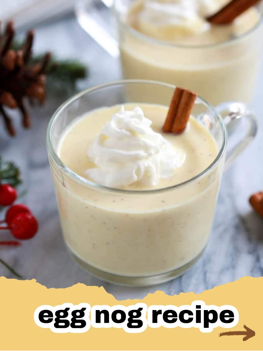The Ultimate Classic Creamy Homemade Eggnog Recipe 1 A festive glass of creamy homemade eggnog garnished with nutmeg and a cinnamon stick, ready for the holidays.