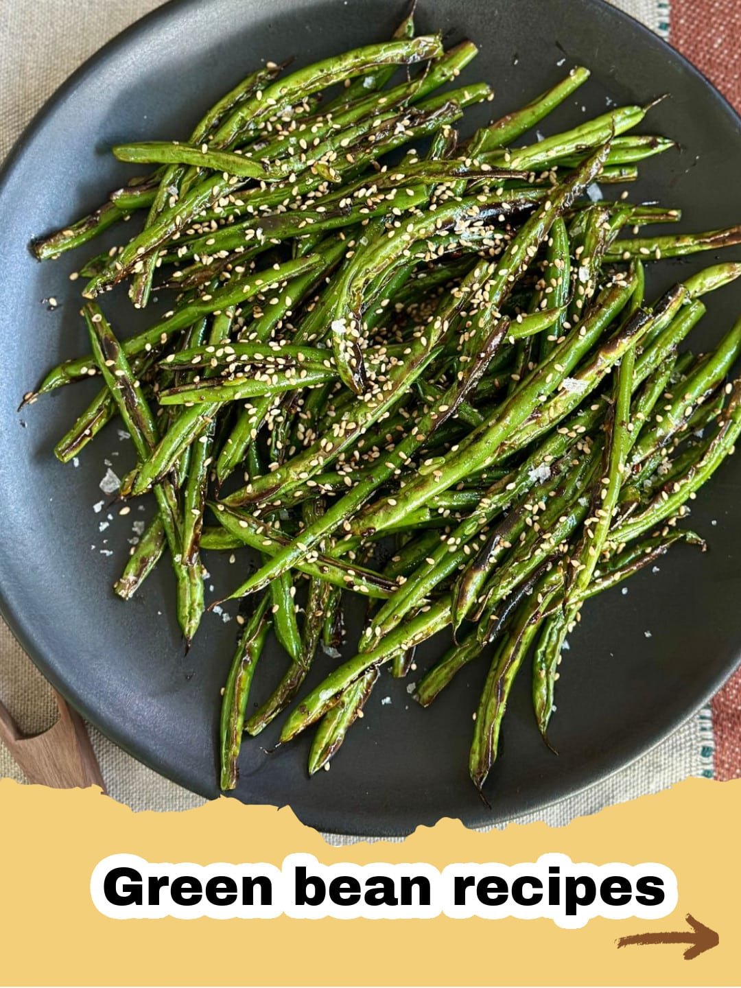 The Absolute Best Quick Blistered Green Beans Recipe for Any Meal 1 A close-up of vibrant green blistered green beans in a cast iron skillet, garnished with fresh lemon wedges.