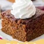 Pile of classic chewy gingerbread cookies dusted with powdered sugar, ready for the holidays.