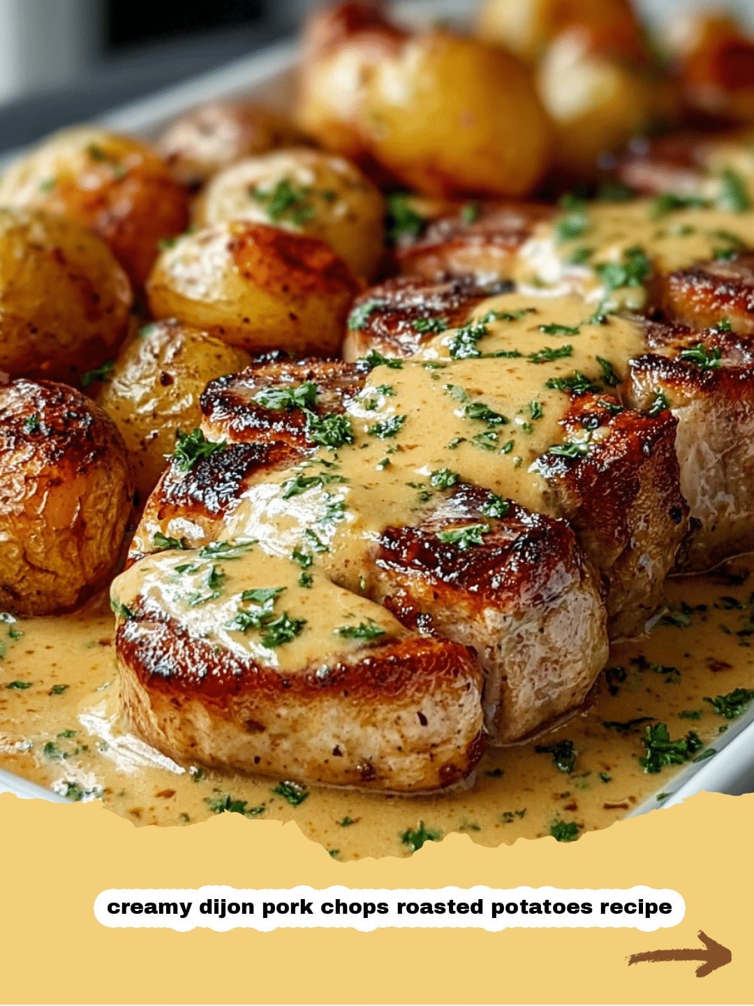 Creamy Dijon Pork Chops with Roasted Potatoes: Your New Favorite Dinner! 1 Pan-seared Creamy Dijon Pork Chops nestled in sauce with roasted potatoes on the side.