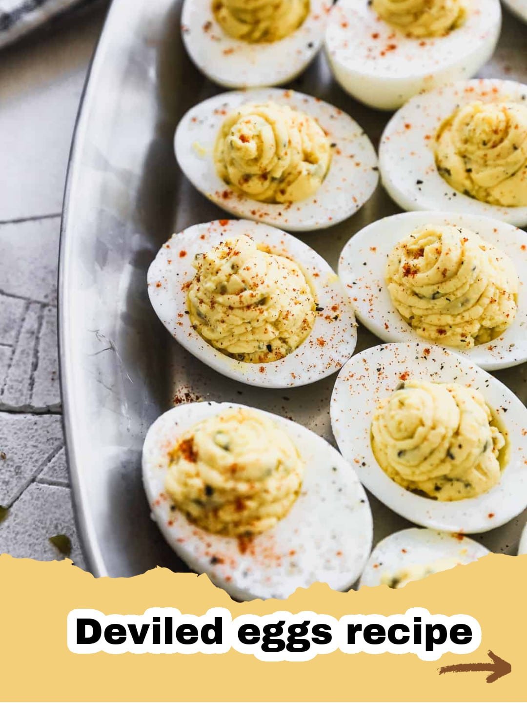 The Secret to Irresistibly Creamy Deviled Eggs: A Family Favorite Recipe 1 A platter of perfectly piped creamy Deviled Eggs garnished with paprika and fresh chives, ready to serve.