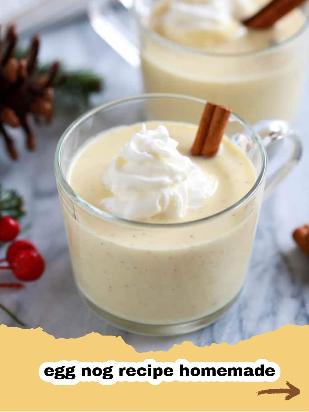 The Ultimate Guide to Classic Homemade Eggnog 1 A festive glass of homemade eggnog, garnished with grated nutmeg and a cinnamon stick, on a cozy holiday backdrop.