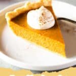The Ultimate Creamy Pumpkin Pie Recipe You'll Adore This Holiday Season 5 A perfectly baked, creamy classic pumpkin pie on a rustic wooden table with a slice removed, topped with whipped cream.