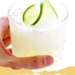 A fresh classic Margarita in a salt-rimmed glass with a lime garnish