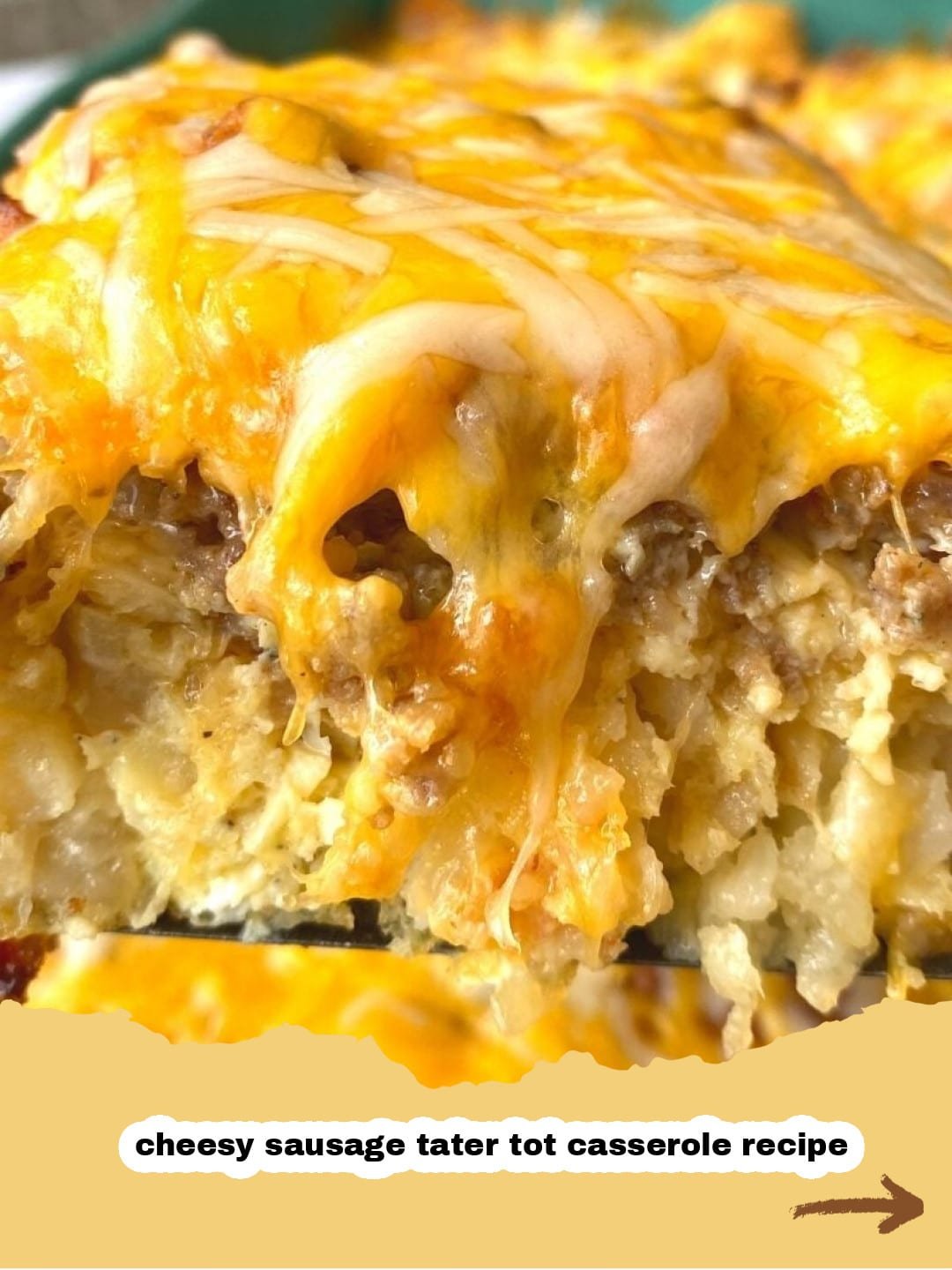 The Ultimate Easy Tater Tot Breakfast Casserole for Any Morning! 1 A golden brown Tater Tot Breakfast Casserole baked in a glass dish, showing crispy tater tots, melted cheese, and sausage, ready to be served.